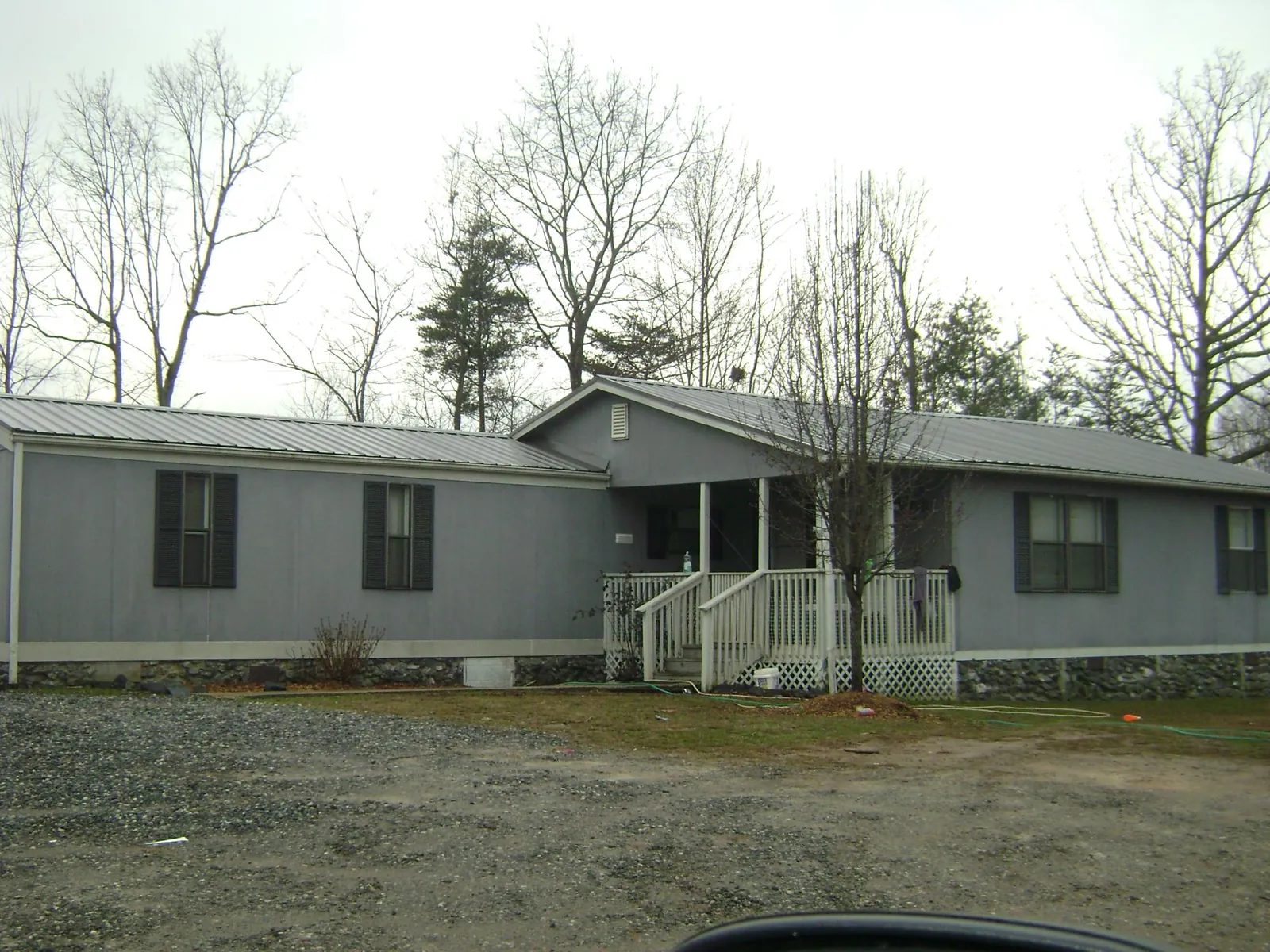 Metal roof over a manufactured home with a covered front porch in Nehalem